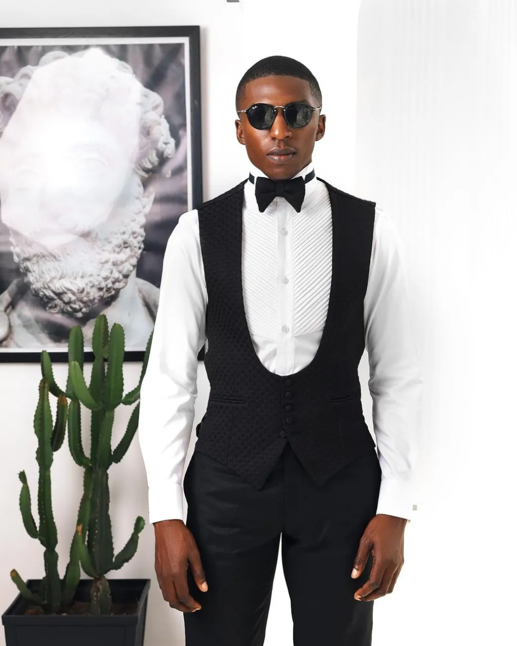 A Charcoal Black U-Cut waist coat with layered back cut.