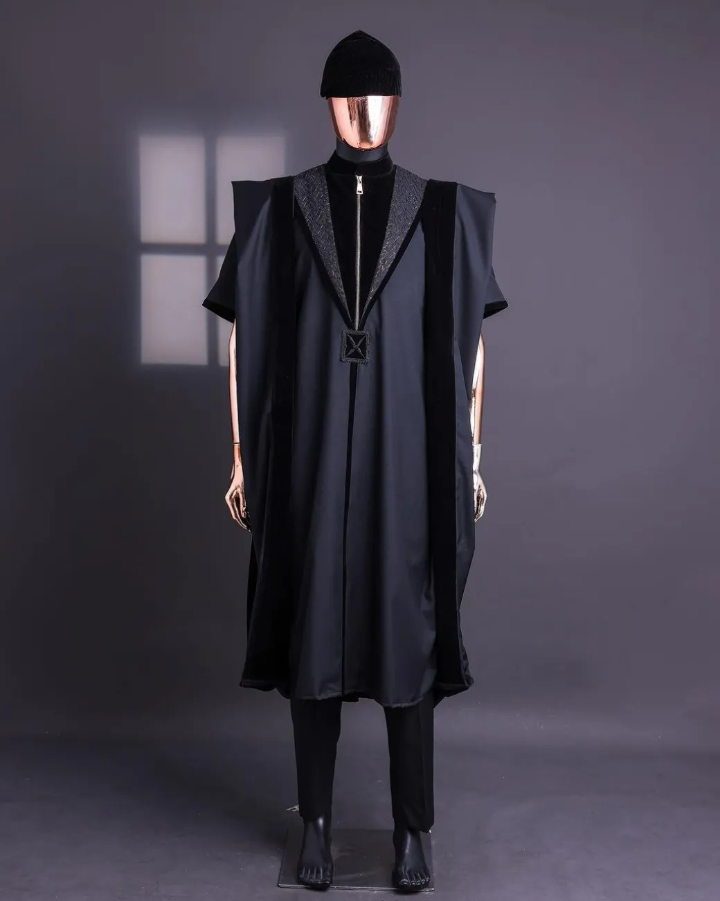 A Charcoal Black, Vehicular Lapelled with Zip Line Flap & Velvet Mix Embroidery Design Details Agbada.