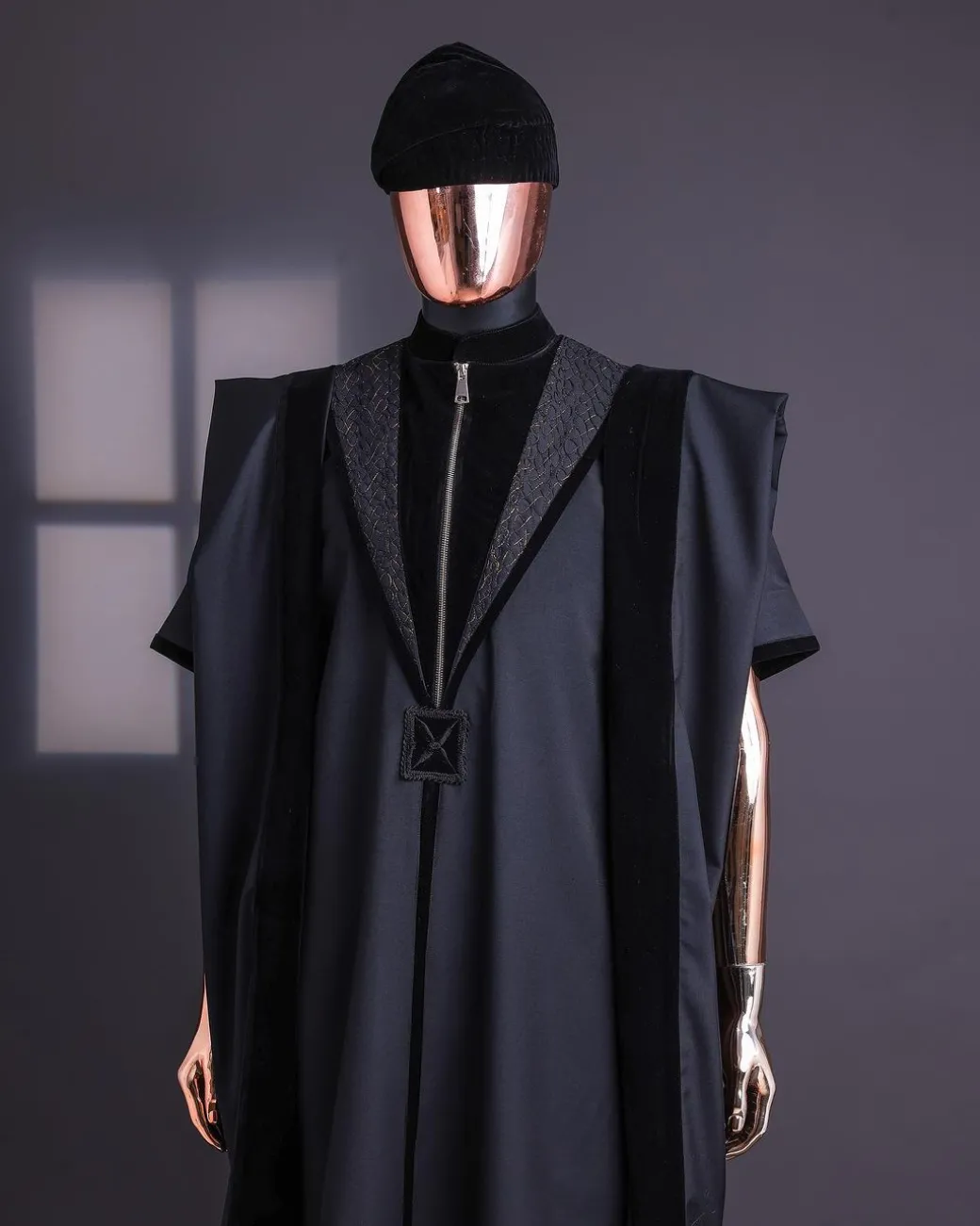 A Charcoal Black, Vehicular Lapelled with Zip Line Flap & Velvet Mix Embroidery Design Details Agbada.
