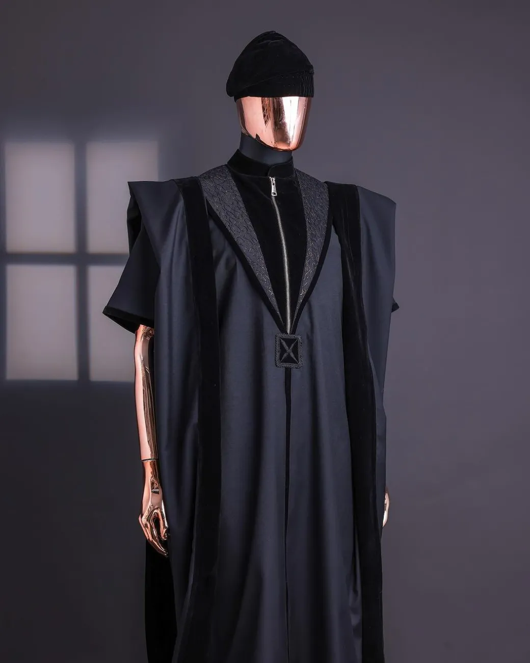 A Charcoal Black, Vehicular Lapelled with Zip Line Flap & Velvet Mix Embroidery Design Details Agbada.