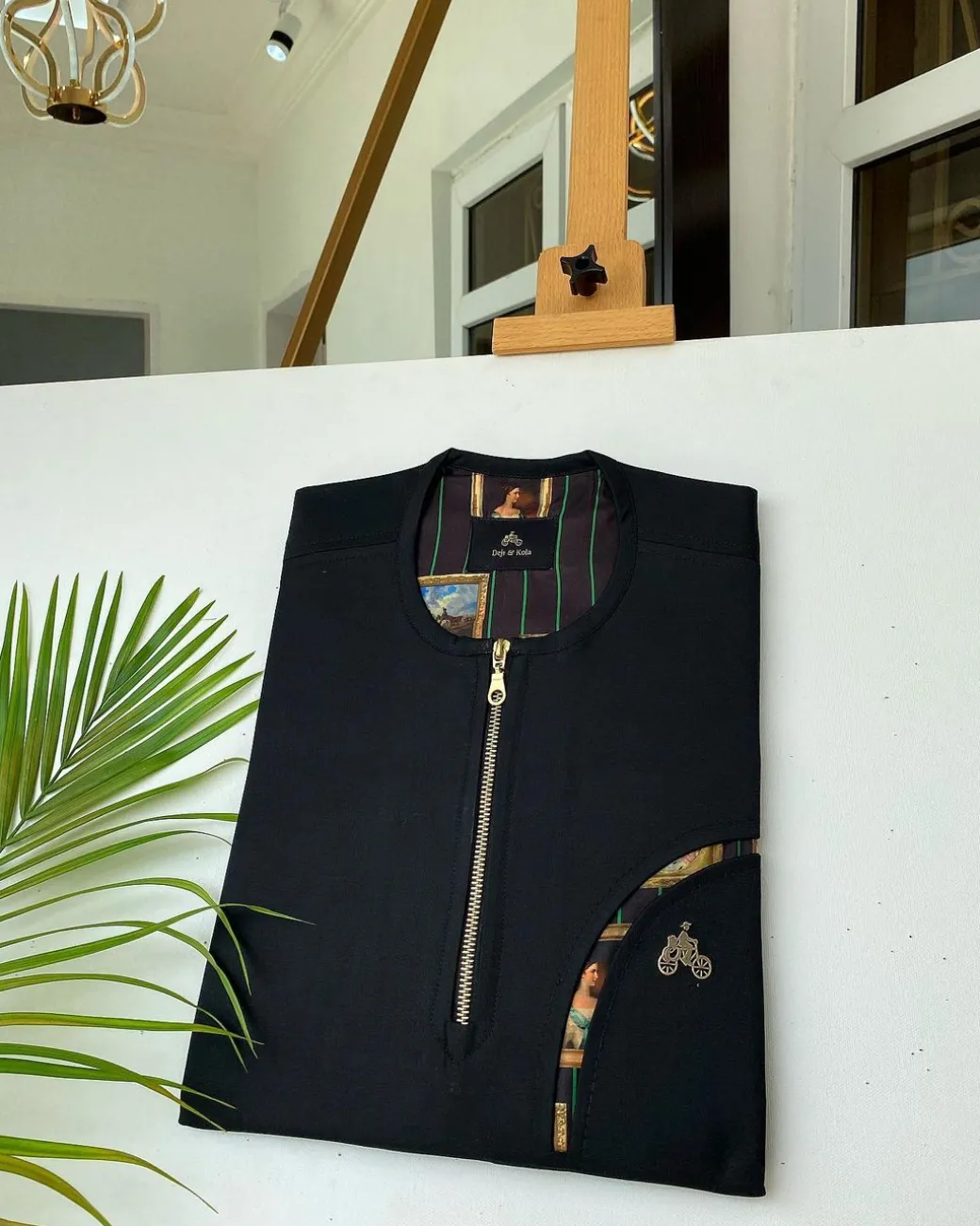 A Charcoal Black with a gold zip opening, a cross-display functional pocket Kaftan