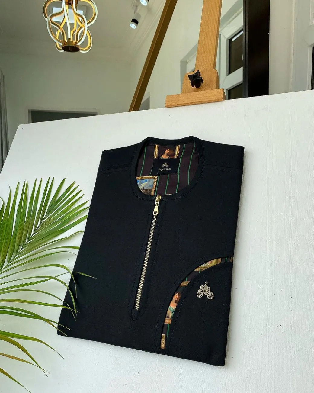 A Charcoal Black with a gold zip opening, a cross-display functional pocket Kaftan