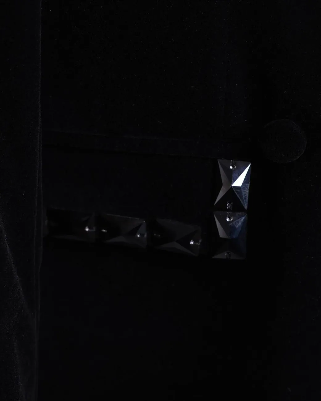 A Charcoal Black wrap velvet peak lapel single button suit with laser cut black glass stones