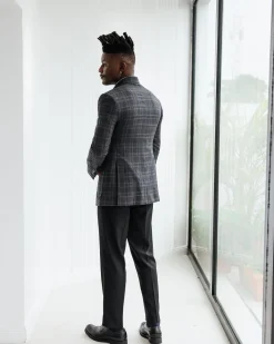 A Charcoal grey, windowpane check, nobility fabric cover coat with patch pocket detailing
