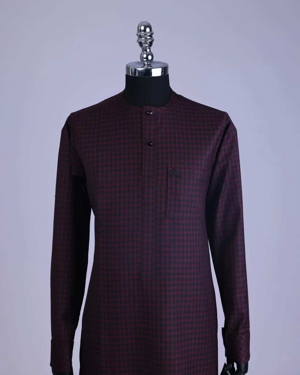 A Checkered black and burgundy with black Swarovski button detailing kaftan and sokoto