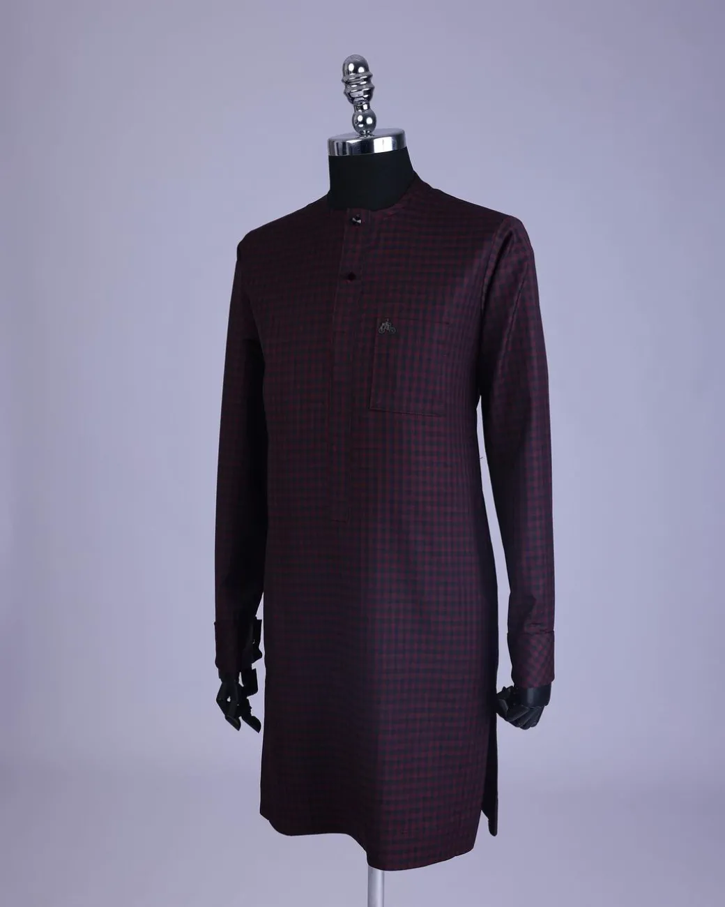 A Checkered black and burgundy with black Swarovski button detailing kaftan and sokoto