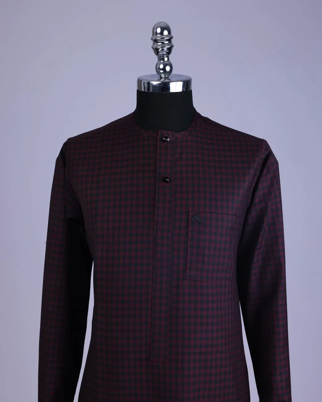 A Checkered black and burgundy with black Swarovski button detailing kaftan and sokoto