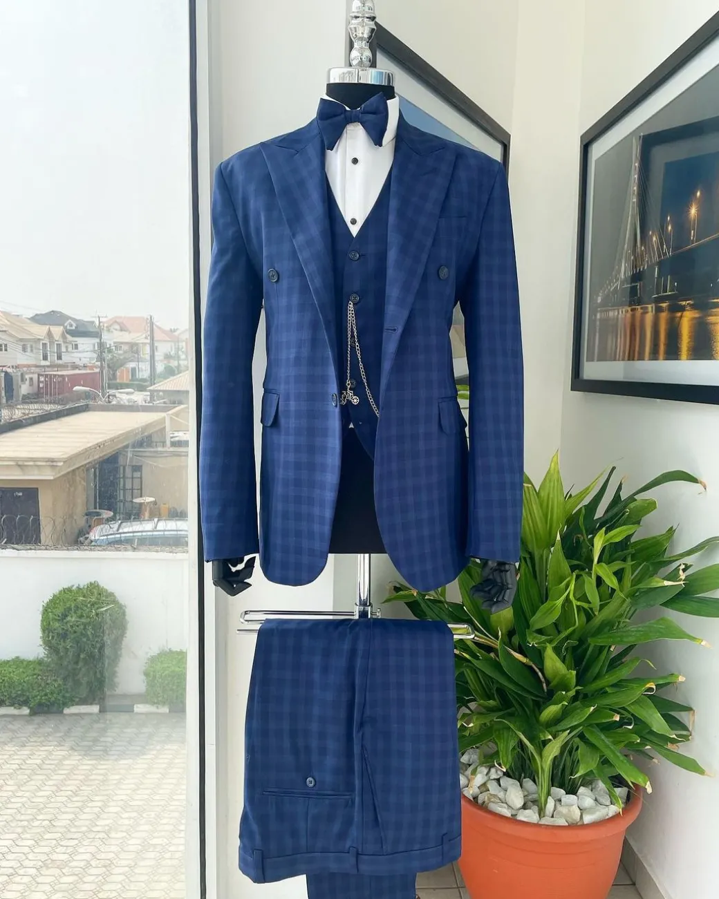 A checkered pattern, peak lapel, 2 button suit