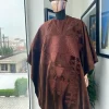 A chocolate brown royal embroidery design agbada, dashiki, hand-knitted matching hat, and Sokoto