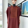 A Cinnamon brown spiral binding embroidery detailing with black and gold ss20 Swarovski stud agbada