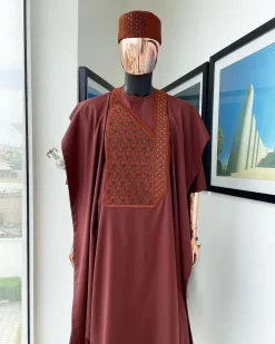A Cinnamon brown spiral binding embroidery detailing with black and gold ss20 Swarovski stud agbada