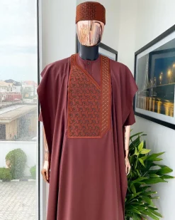 A Cinnamon brown spiral binding embroidery detailing with black and gold ss20 Swarovski stud agbada