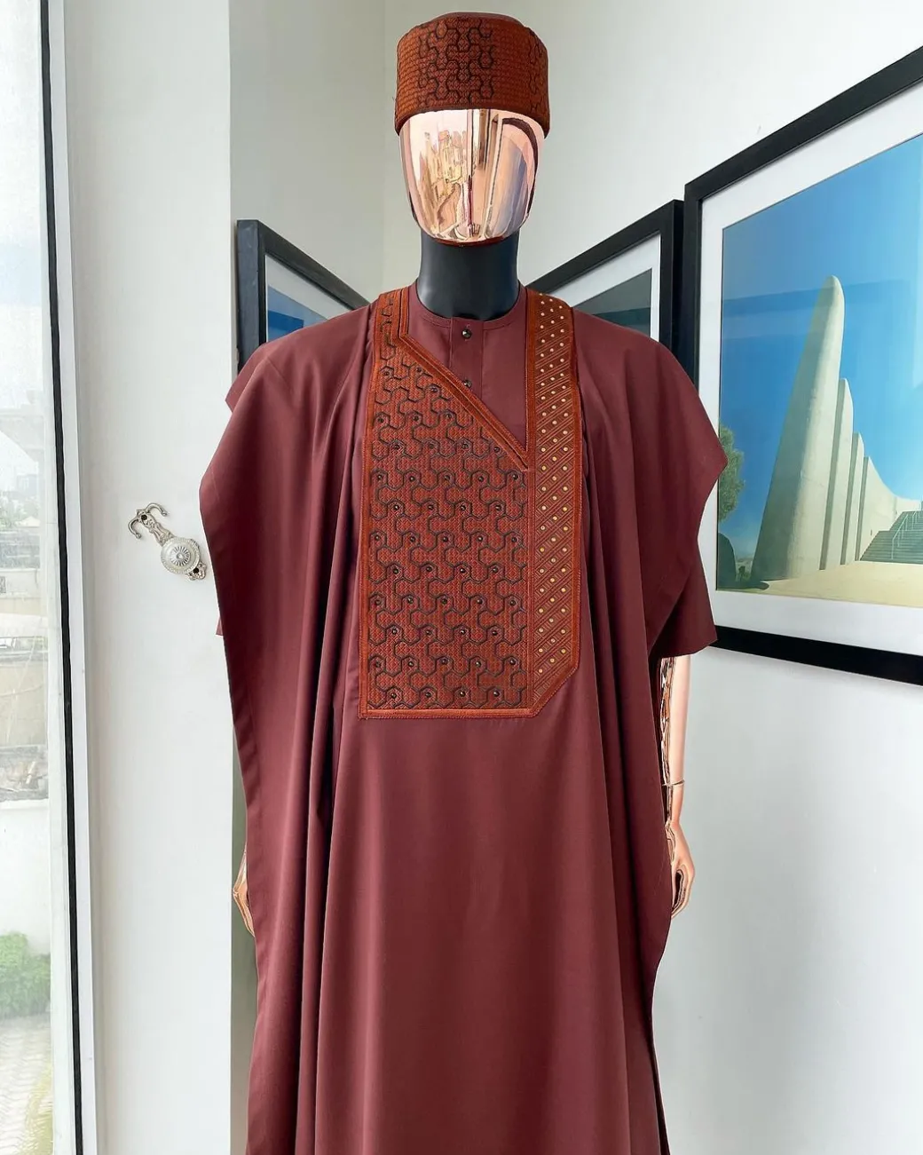 A Cinnamon brown spiral binding embroidery detailing with black and gold ss20 Swarovski stud agbada