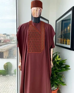 A Cinnamon brown spiral binding embroidery detailing with black and gold ss20 Swarovski stud agbada