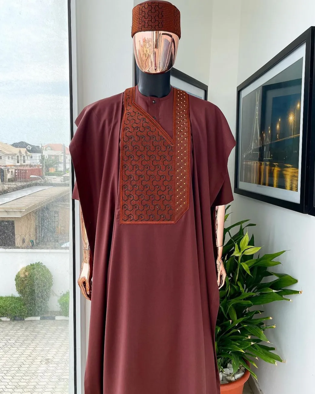 A Cinnamon brown spiral binding embroidery detailing with black and gold ss20 Swarovski stud agbada