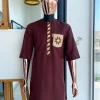 A cinnamon brown, sunrise in the east embroidery detailing hat & patch pocket traditional senator kaftan native.