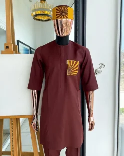 A Cinnamon brown, sunset in the east embroidery detailing hat and patch pocket traditional senator kaftan native.