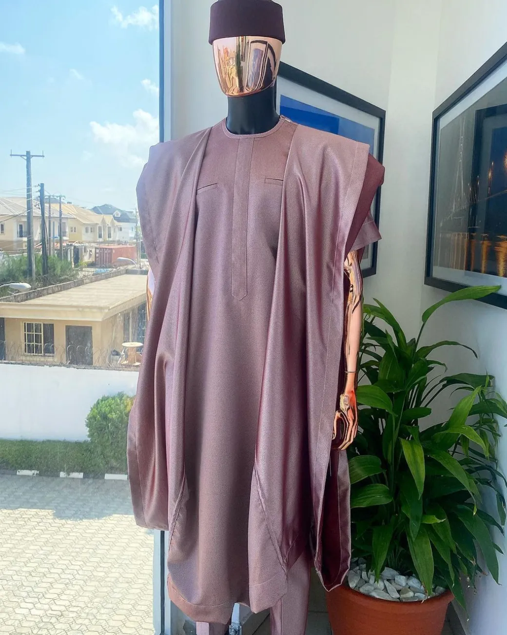 A classic light burgundy “kagbada”, Senator kaftan, burgundy round hat And sokoto
