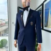 A Classic Navy Blue, Peak Lapel Tuxedo Suit