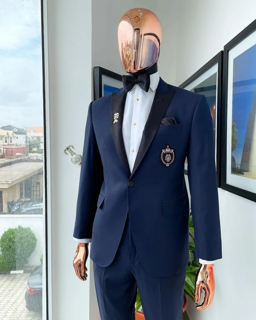 A Classic Navy Blue, Peak Lapel Tuxedo Suit