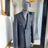 A Classic Peak Lapel Grey Pin Stripe Double Breasted Suit
