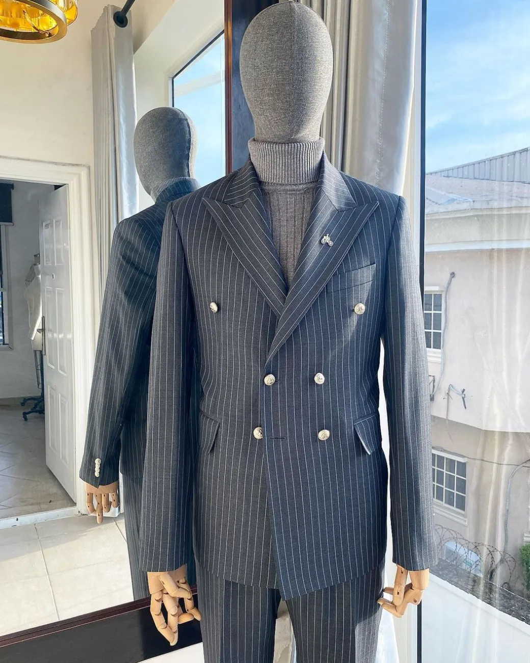 A Classic Peak Lapel Grey Pin Stripe Double Breasted Suit