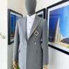 A Cloud Grey Peak Lapel, One button Double Breasted Suit.