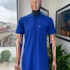A cobalt blue front flap with a patch pocket details African traditional senator kaftan native