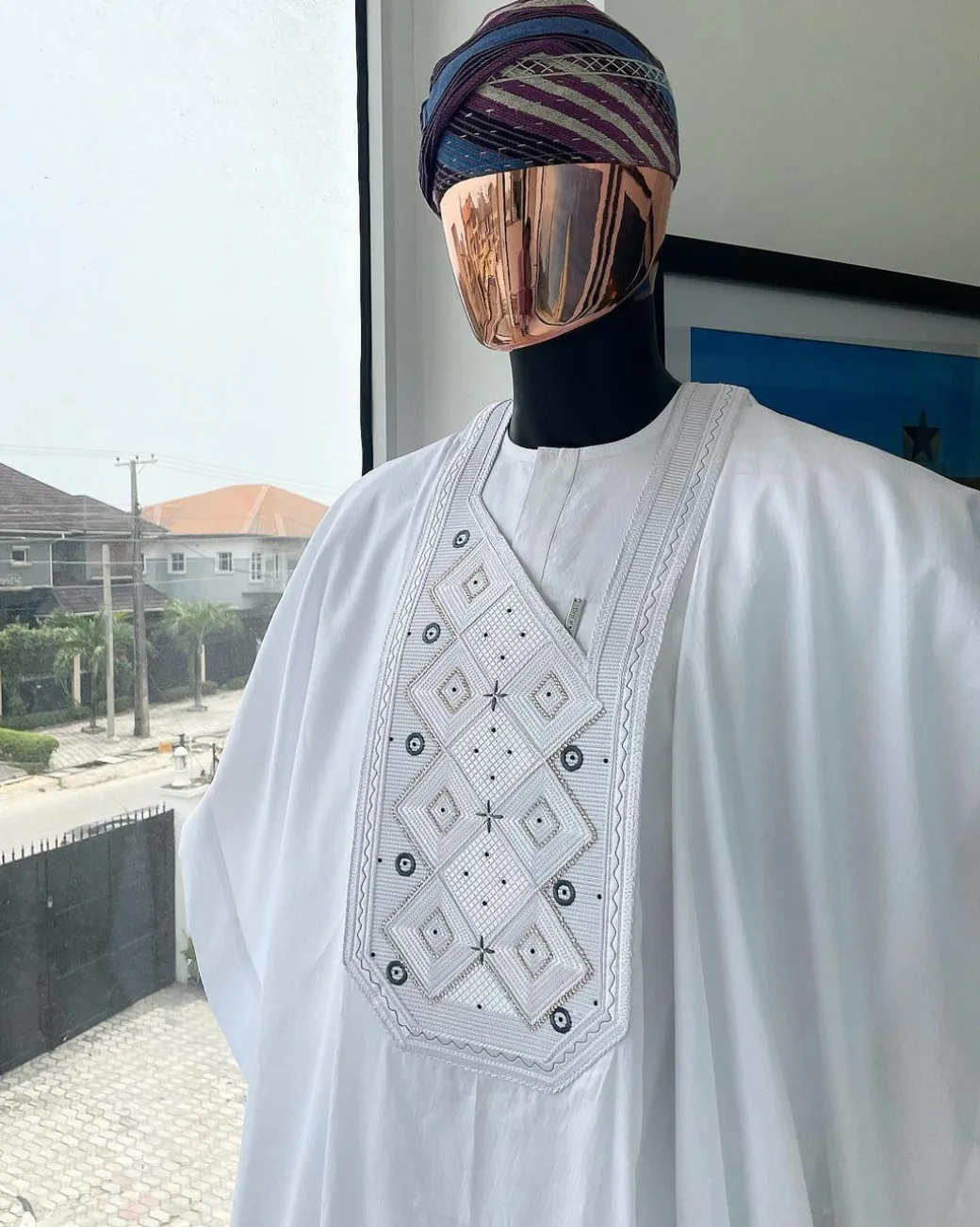 A Cocaine white, Square dropping-layered embroidery design details agbada