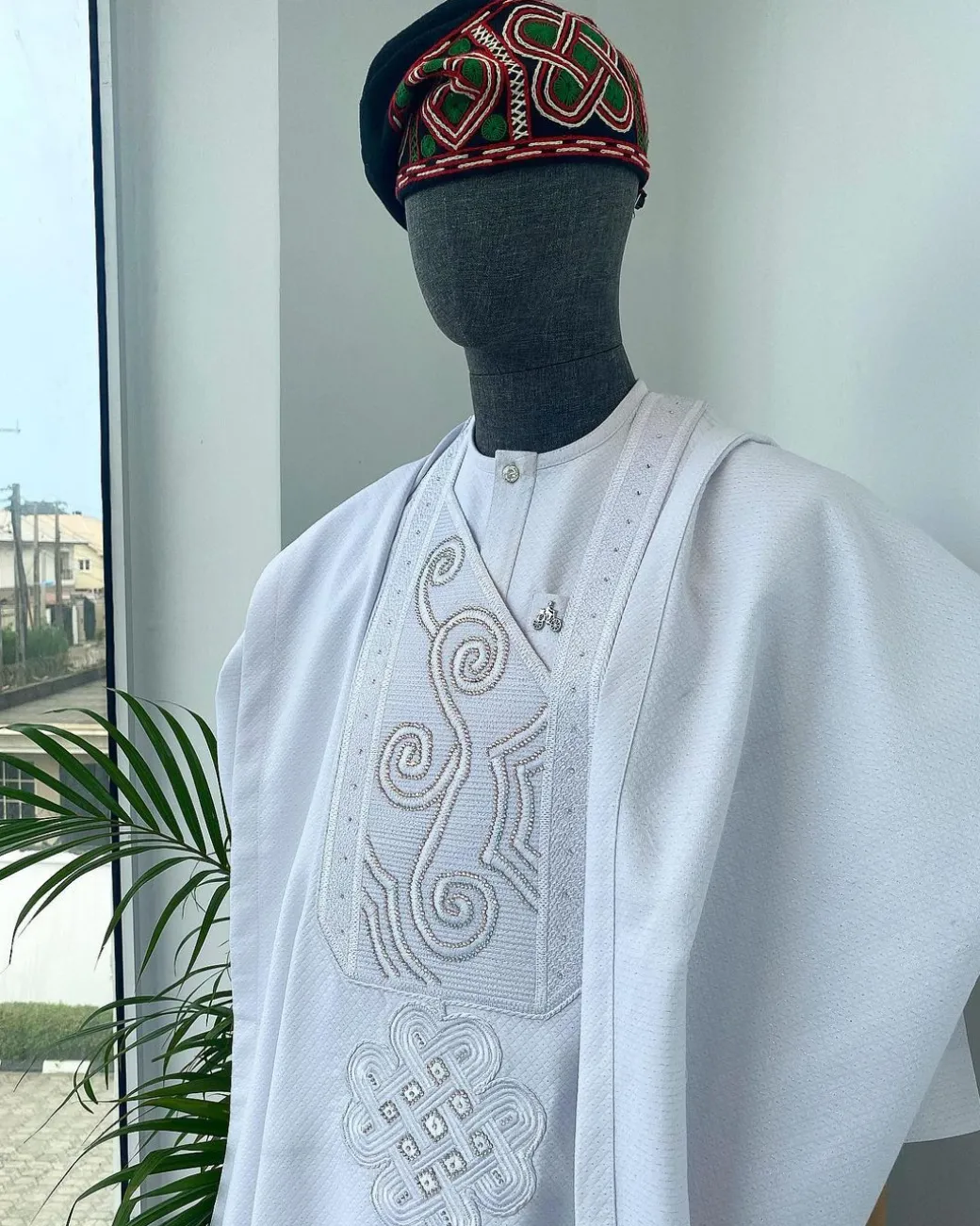 A Cocaine white with a floral Japanese intersection design with Swarovski stone detailing Agbada