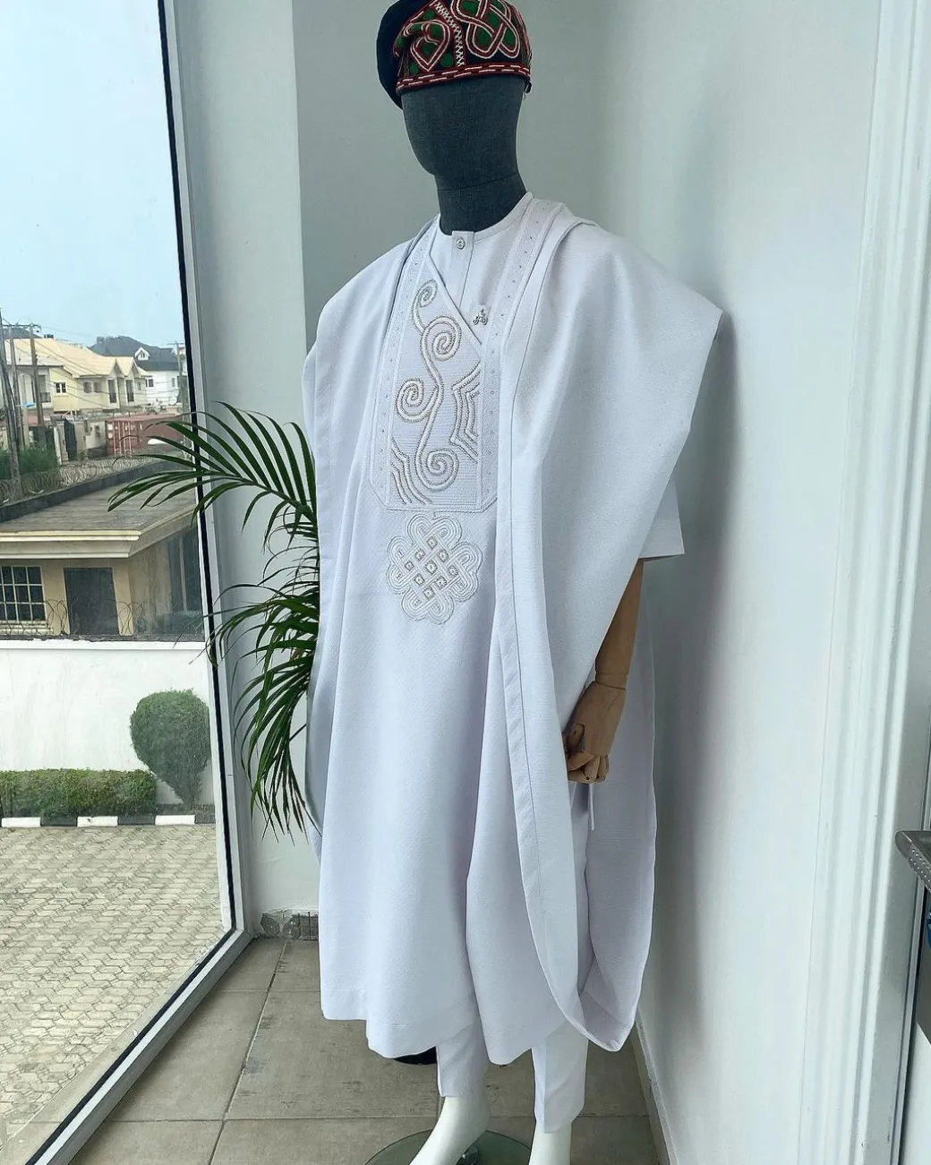 A Cocaine white with a floral Japanese intersection design with Swarovski stone detailing Agbada