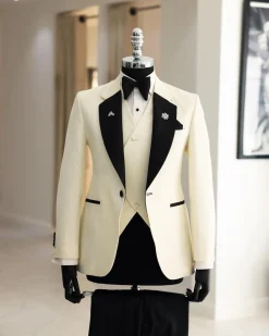 A Cream white, dotted square pattern jacquard notch lapel tuxedo suit.