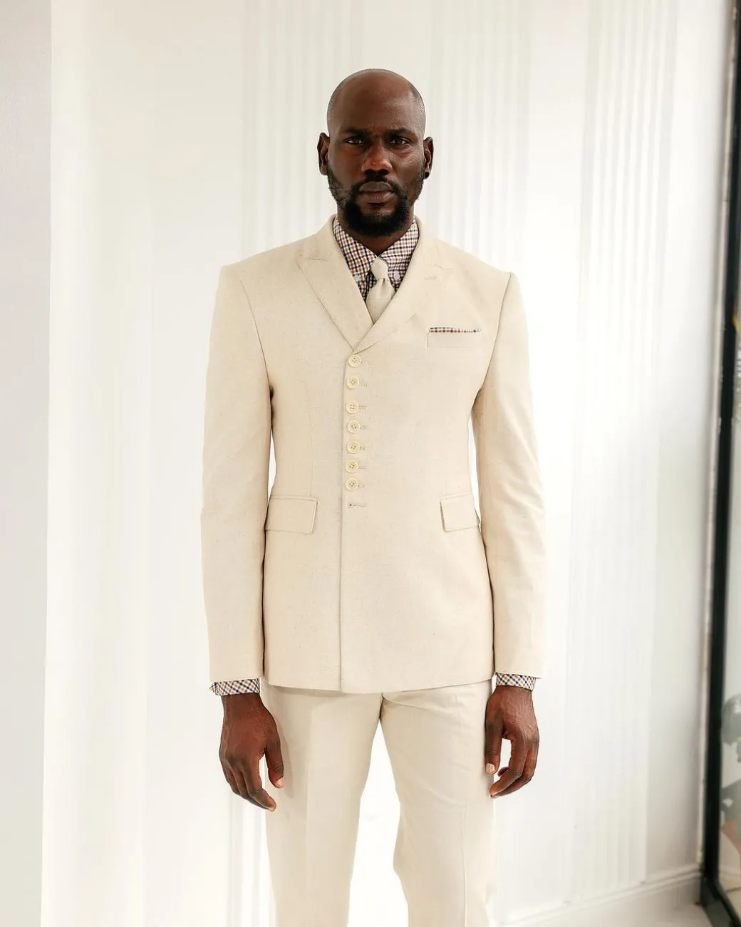 A Cream White, Wrap, Peak Lapel Jacket & Pant Trousers.
