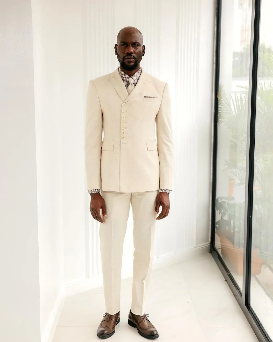 A Cream White, Wrap, Peak Lapel Jacket & Pant Trousers.