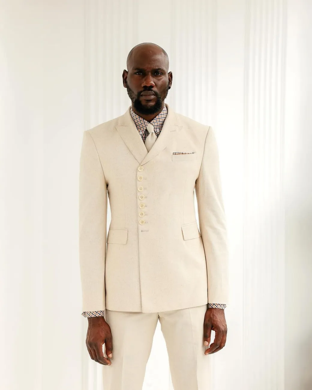 A Cream White, Wrap, Peak Lapel Jacket & Pant Trousers.