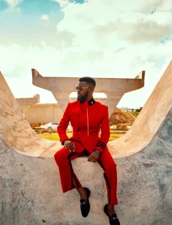 A Crimson red, peak lapel, single button wrap suit