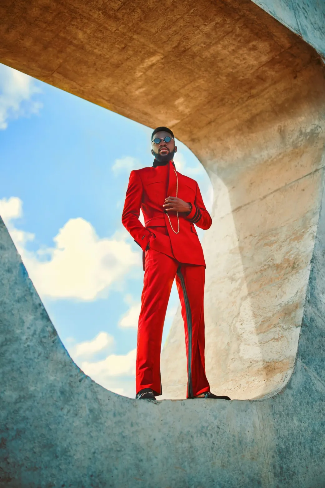 A Crimson red, peak lapel, single button wrap suit