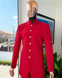 A Crimson red safari suit with matching Swarovski stones detailing