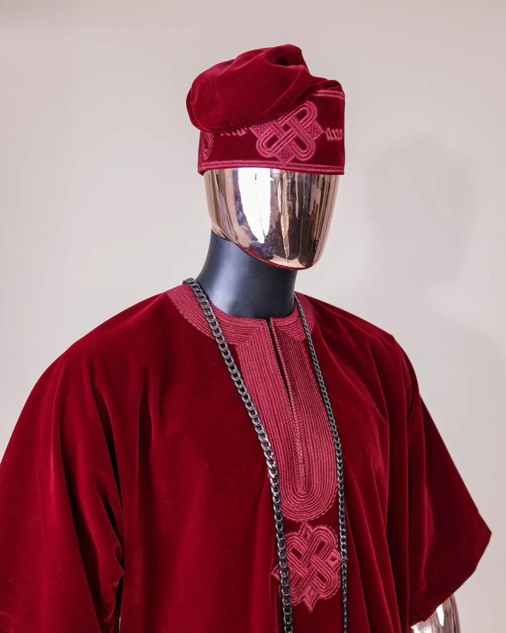 A crimson red, U shaped neck, letters floral, 3/4 sleeve embroidery details African senator kaftan native.
