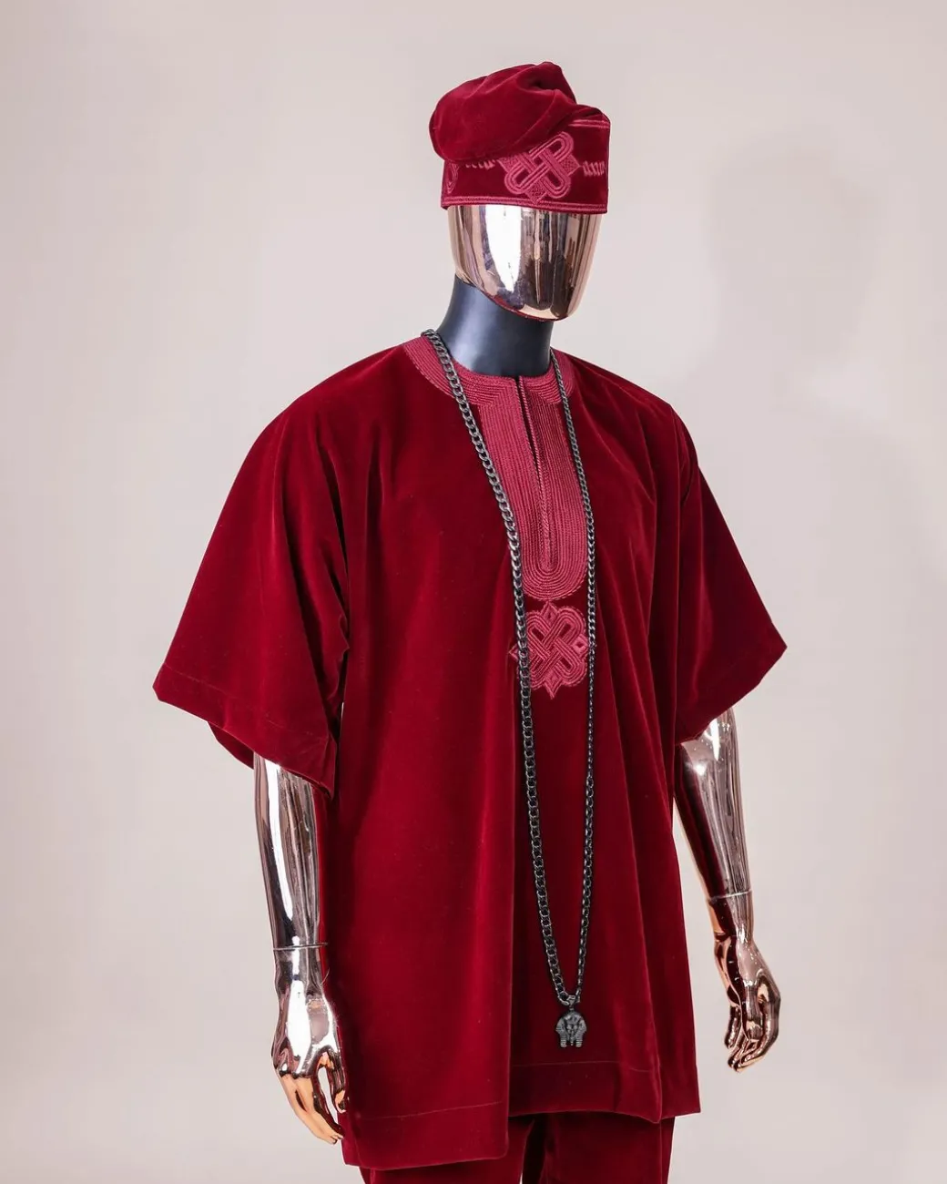 A crimson red, U shaped neck, letters floral, 3/4 sleeve embroidery details African senator kaftan native.