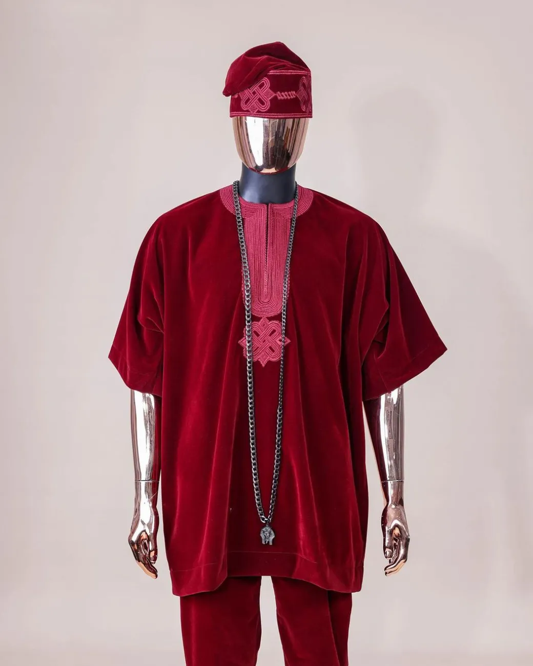 A crimson red, U shaped neck, letters floral, 3/4 sleeve embroidery details African senator kaftan native.