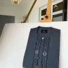 A Dark grey Irish petal embroidery detail and a mid-section flap button Swarovski African Kaftan