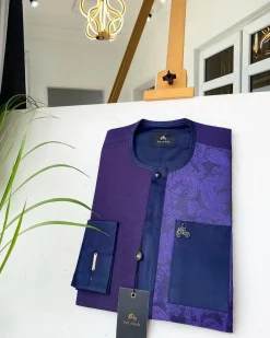A dark purple matching paisley left section, and a silk blue flap and pocket with a Swarovski African Kaftan