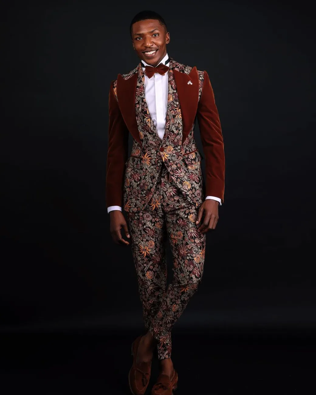 A “Dent” Floral Syrup Brown Metallic Jacquard Peak Quad Lapel Suit, Bow Tie & Gurkha Pant Trousers.