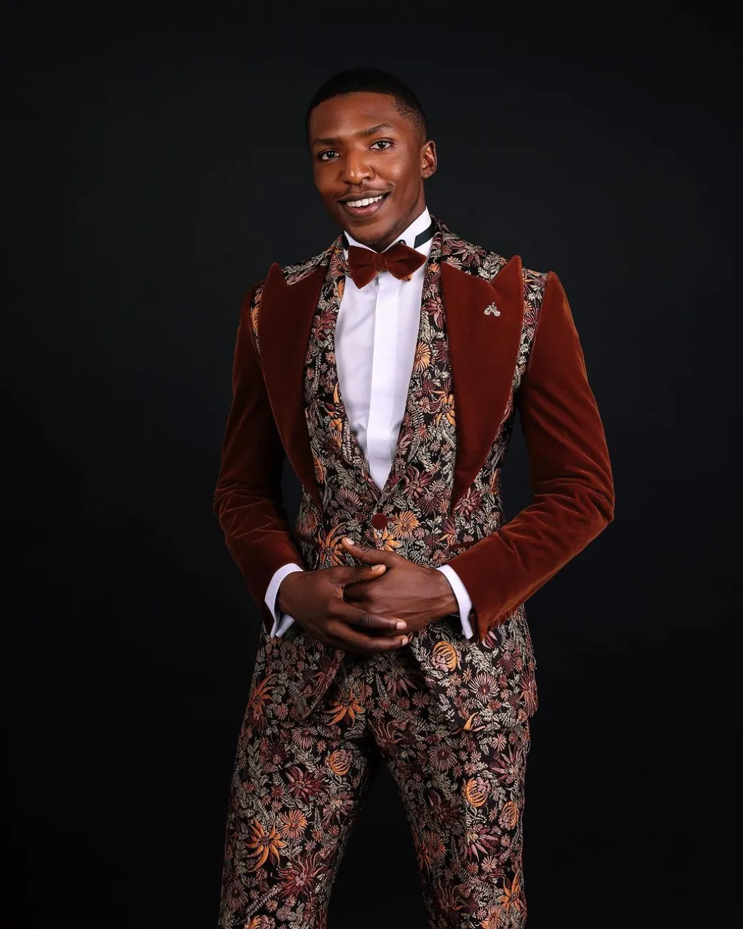 A “Dent” Floral Syrup Brown Metallic Jacquard Peak Quad Lapel Suit, Bow Tie & Gurkha Pant Trousers.