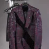 A diagonal cut layered black velvet Swarovski detailing burgundy and black patterned suit
