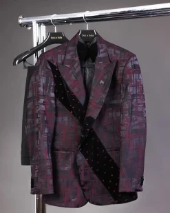 A diagonal cut layered black velvet Swarovski detailing burgundy and black patterned suit