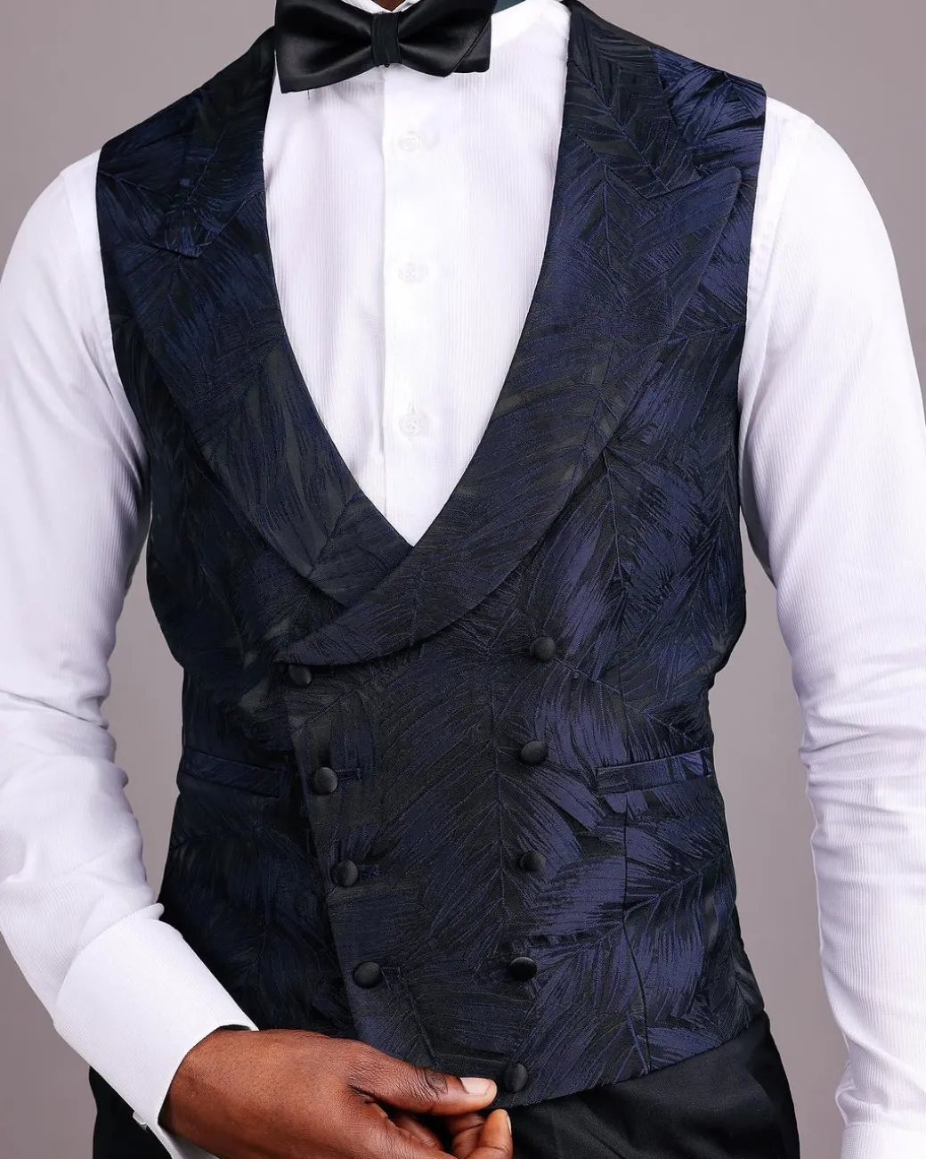 A Double-Breasted, Curved Peak Lapel Waistcoat.