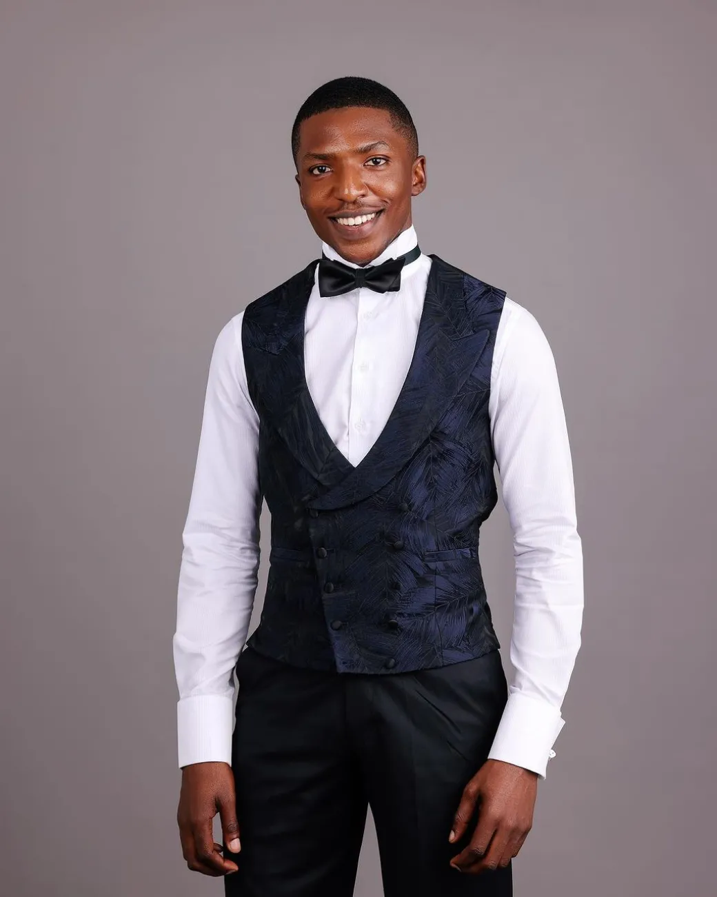A Double-Breasted, Curved Peak Lapel Waistcoat.