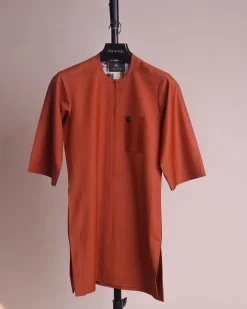 A fire orange and black pencil stripe, zipline, 3/4 sleeve African senator kaftan native.